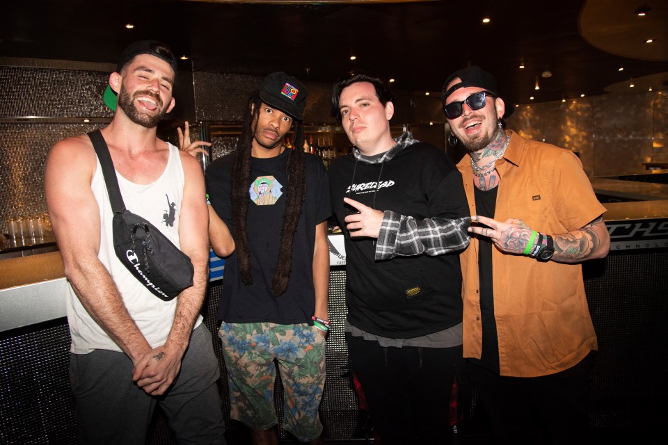 Dropout Kings posing on a cruise ship.