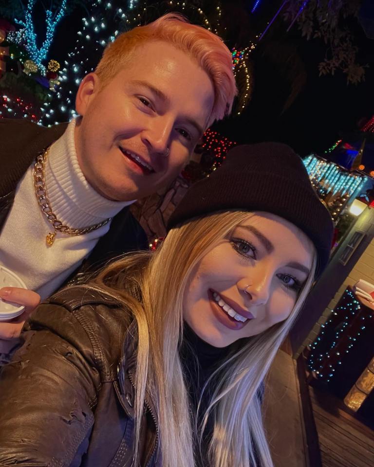 Adam Ramey and his partner at a Christmas light display.