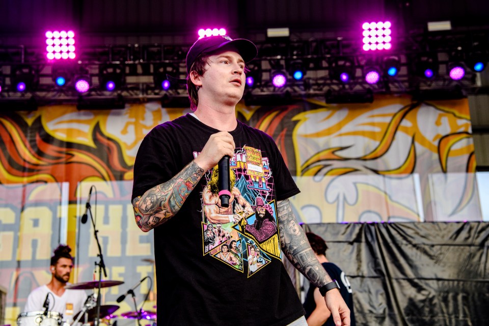 Adam Ramey of Dropout Kings performing on stage.
