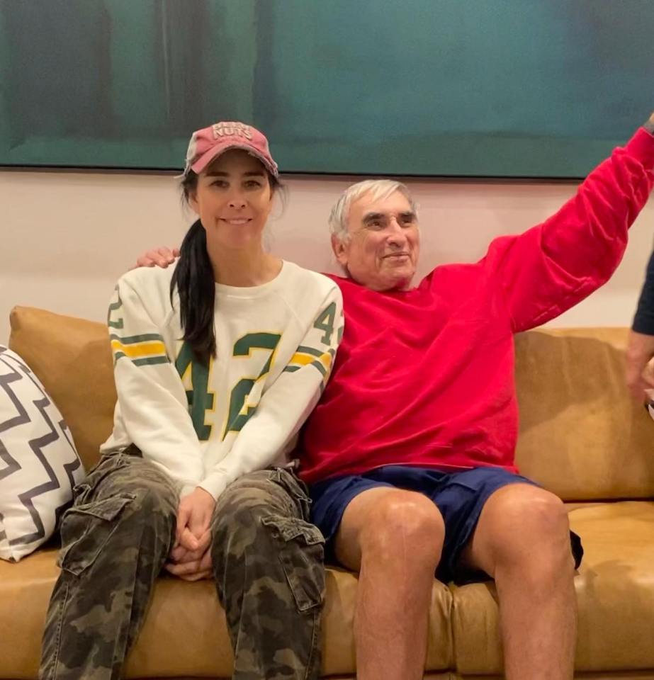 Sarah Silverman and her grandfather sitting on a couch.