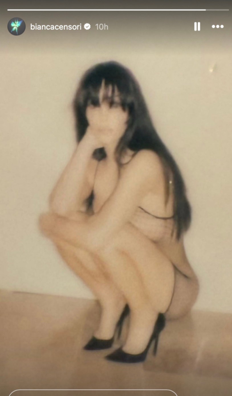 bianca-censori-rocks-sheer-fishnet-dress-and-long-hair-in-new-photo