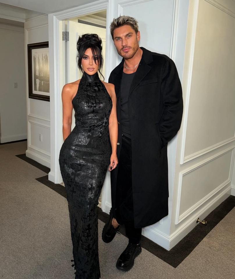 Kim Kardashian and Chris Appleton posing together.