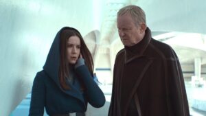 Kleya in a hood with Luthen outside on Andor