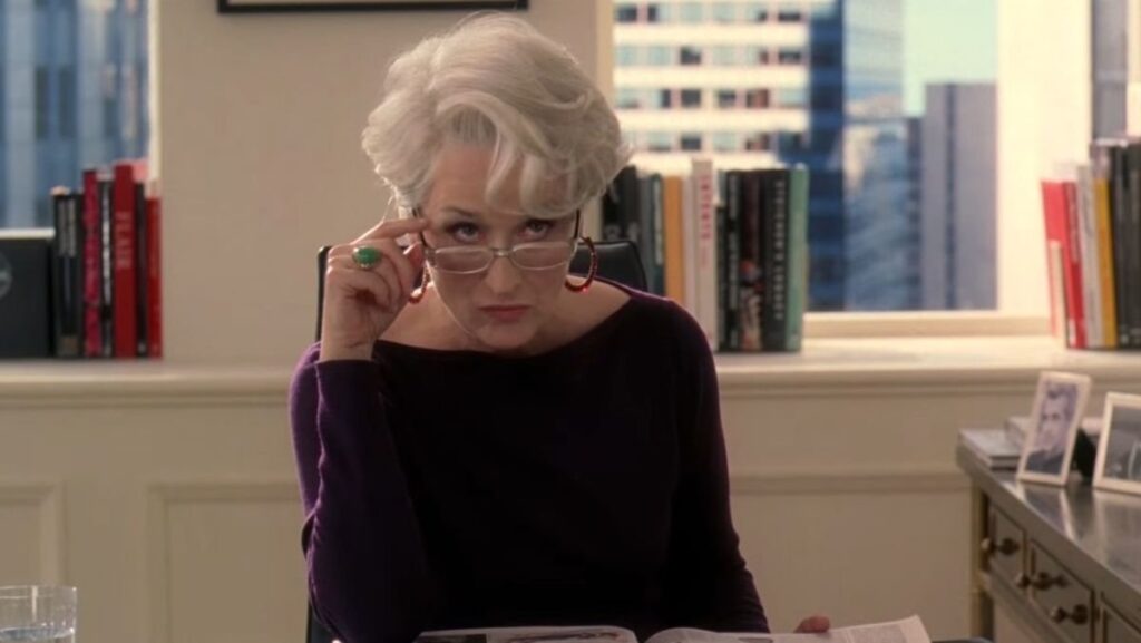 Miranda looks over her glasses in disgust in The Devil Wears Prada