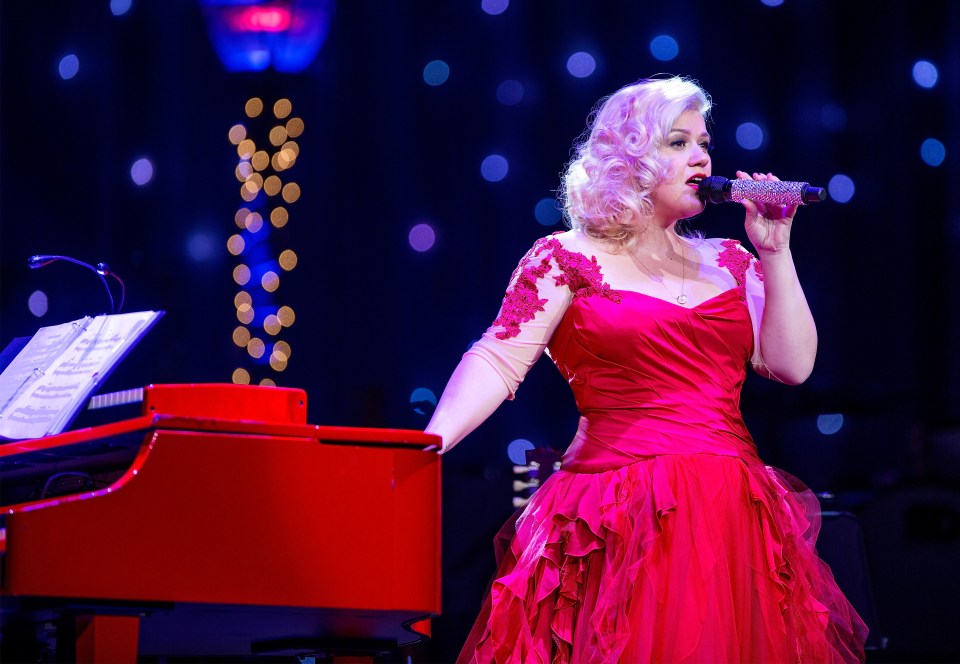 Kelly Clarkson performing on stage.