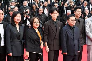 Jackson Yi, Gan Bi, Mark Chao during the Closing Ceremony of the 78th Cannes Film Festival held at the Palais des Festivals on May 24, 2025 in Cannes, France.