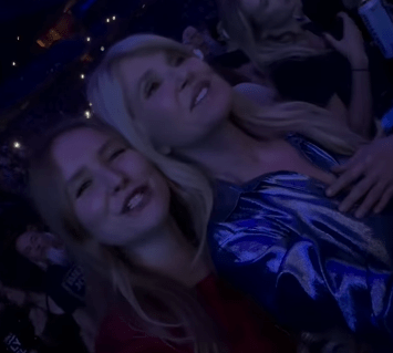 Christie Brinkley with a woman at a concert.