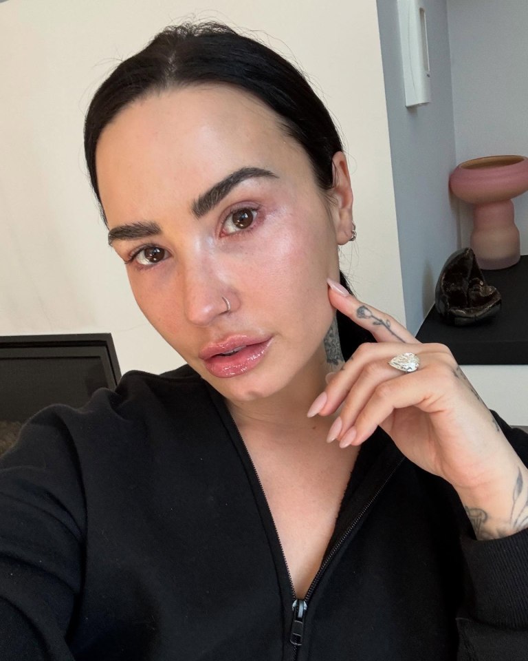 Demi Lovato showing off her engagement ring.