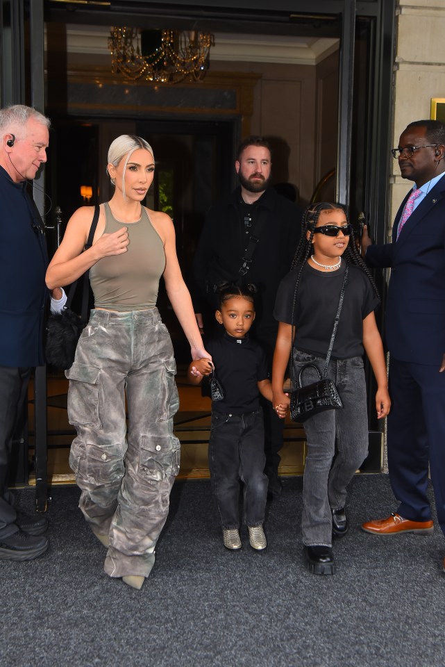 Kim Kardashian with her children North and Chicago West leaving a building.