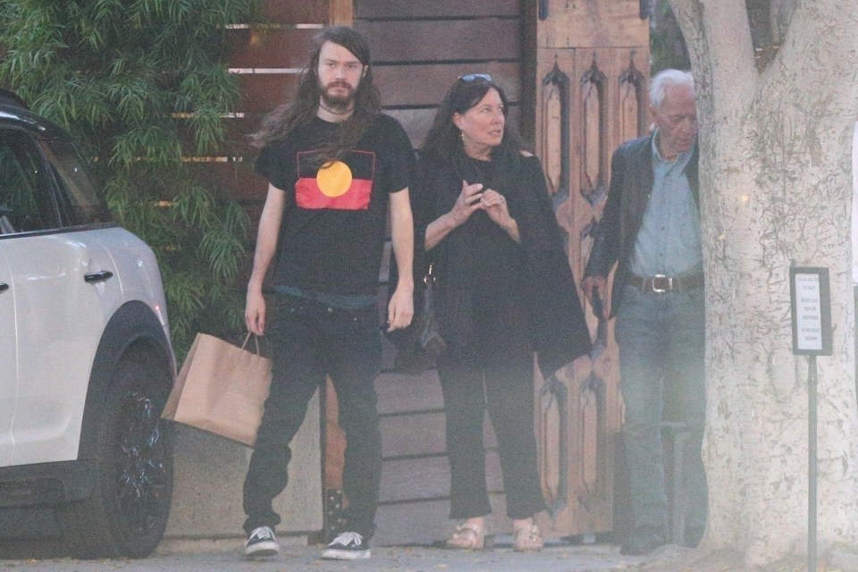Paul Hogan with his son and ex-wife leaving a restaurant.