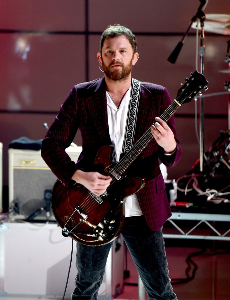 Caleb Followill of Kings of Leon performing on stage.