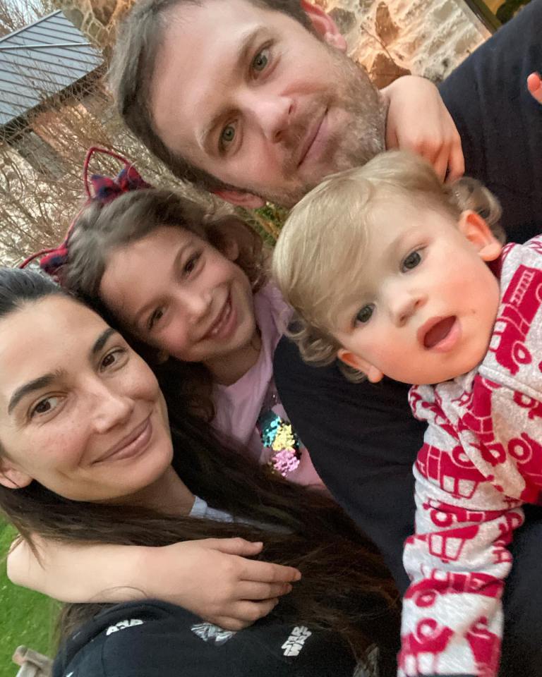 Family selfie with two parents and two children.