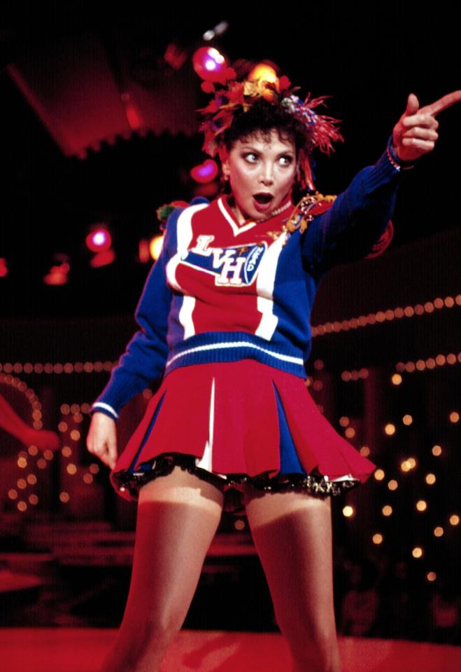 Toni Basil performing in a cheerleader costume.