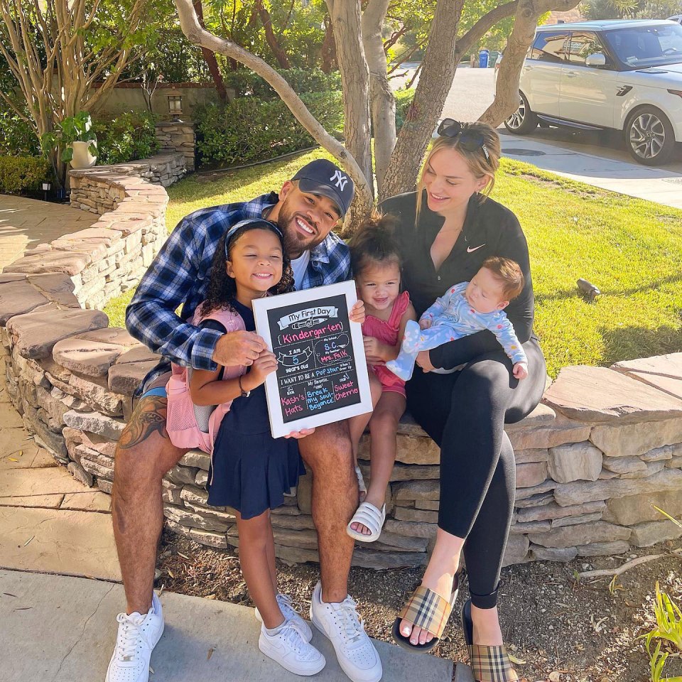 Family celebrating child's first day of kindergarten.