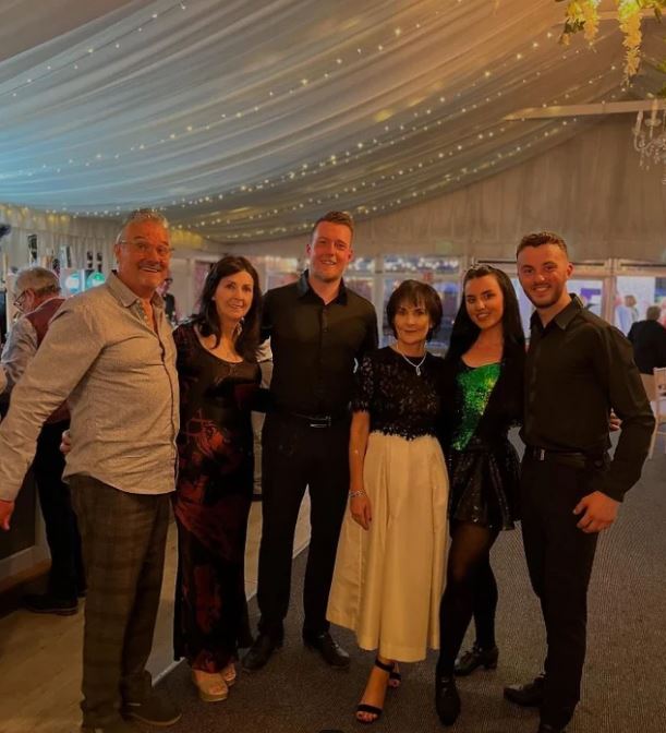 Singer Enya with a group of people at an event.