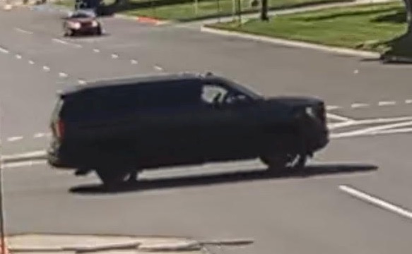 GMC Yukon SUV involved in a pedestrian accident.