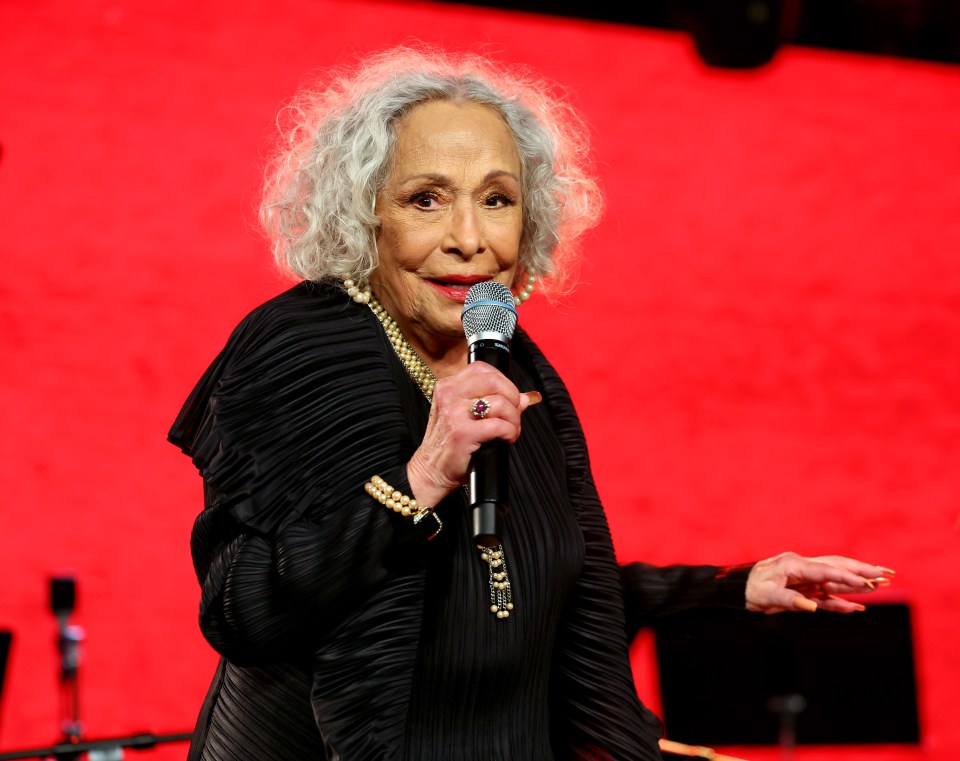 Renée Victor accepting a lifetime achievement award.