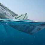 image of sinking money as a ship