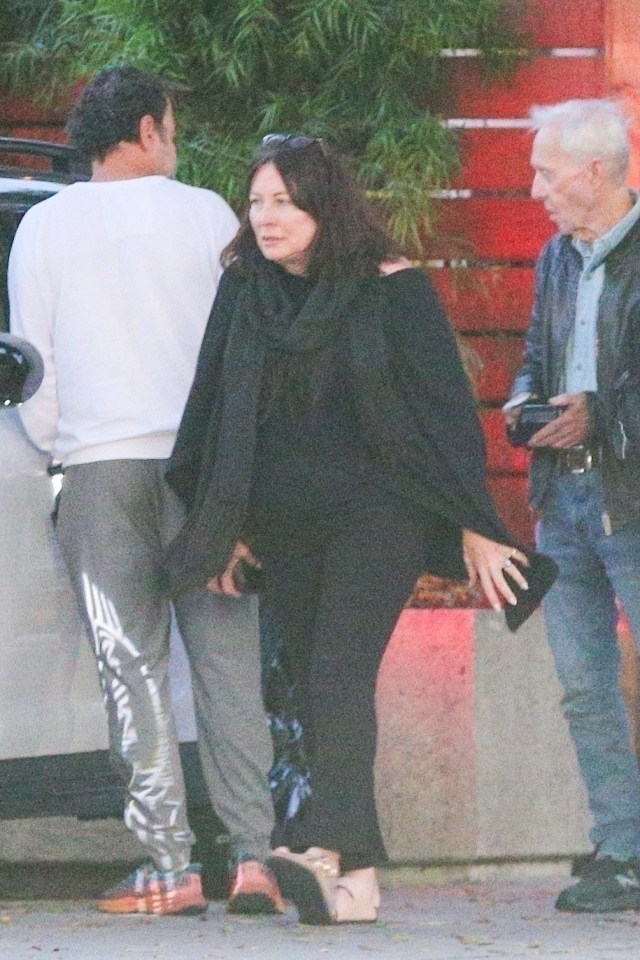 Paul Hogan, his son Chance, and ex-wife Linda Kozlowski leaving a restaurant.