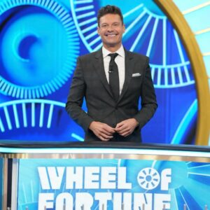 Ryan Seacrest on the Wheel of Fortune set.