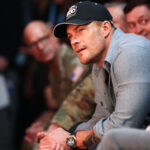 alan ritchson wearing a hat