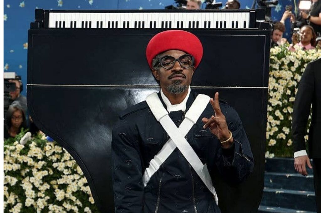 André 3000 Wore A Baby Grand Piano On His Back To The 2025 Met Gala, And For A Very Good Reason