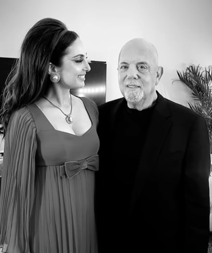 Black and white photo of Billy Joel and his daughter Alexa.