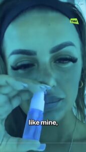 screenshot from a TikTok showing a woman using a tanning nasal spray