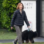 Anne Archer walking a dog.