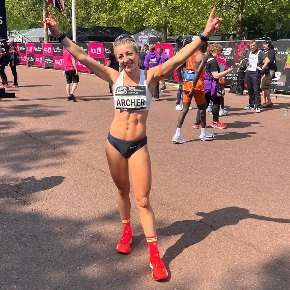 Runner Holly Archer celebrating a race victory.