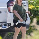 Brooke Thompson, aka "Pumpkin," walking near a vehicle.