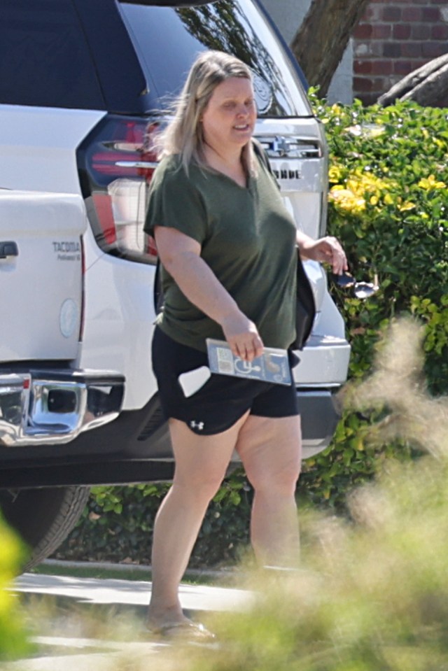 Brooke Thompson, aka "Pumpkin," walking near a vehicle.