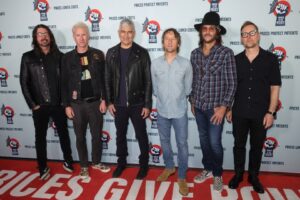Foo Fighters band members at a Power to the Patients concert.