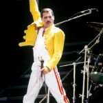 Freddie Mercury of Queen performing on stage.