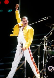 Freddie Mercury of Queen performing on stage.