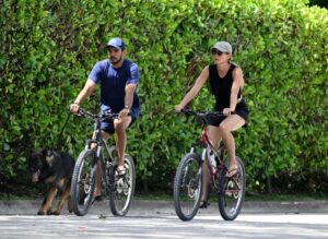 Joaquim Valente (left) and Gisele Bündchen (right), who are both from Brazil, are seen on a bike ride on July 14, 2024, in Surfside, Florida.