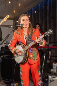 Julien Baker performing with a banjo.