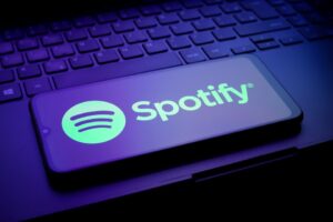 Illustration of the Spotify logo on a smartphone screen.