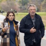 Alec Baldwin and Hilaria Baldwin walking down a road.