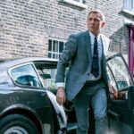 Daniel Craig as James Bond exiting a car.