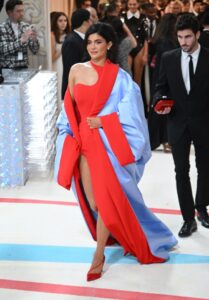 Kylie Jenner at the Met Gala in a red and light blue dress.