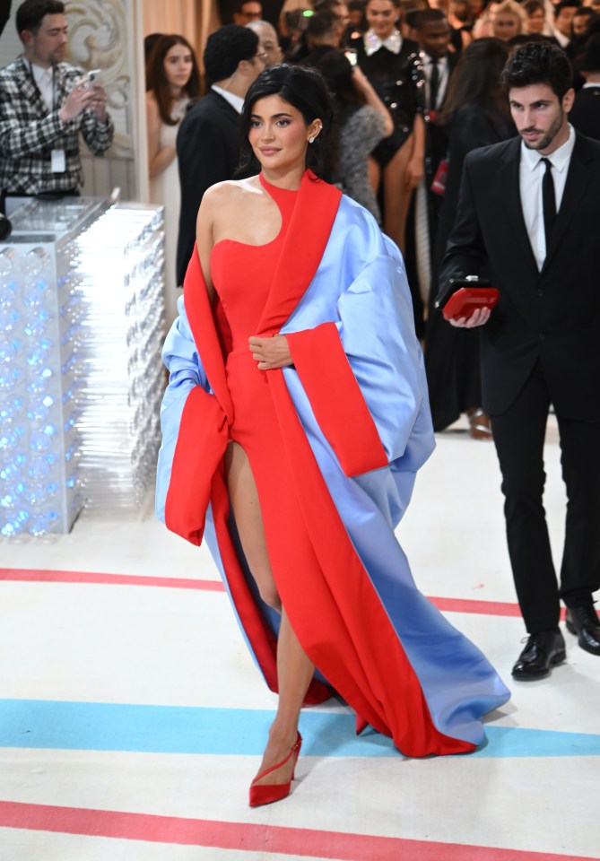 Kylie Jenner at the Met Gala in a red and light blue dress.