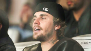 Justin Bieber wearing a black hat at the Super Bowl