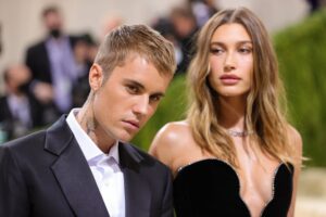 Justin Bieber's caption about wife Hailey Bieber's Vogue cover quickly became the focus of the story on Tuesday.