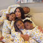 Kim Kardashian with her children in matching Easter pajamas.