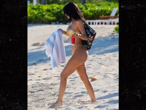 0513-Kylie-Jenner-In-A-Gold-Thong-Bikini-On-The-Beach-In-Turks-And-Caicos-primary-2