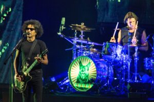 Alice in Chains performing live on stage.