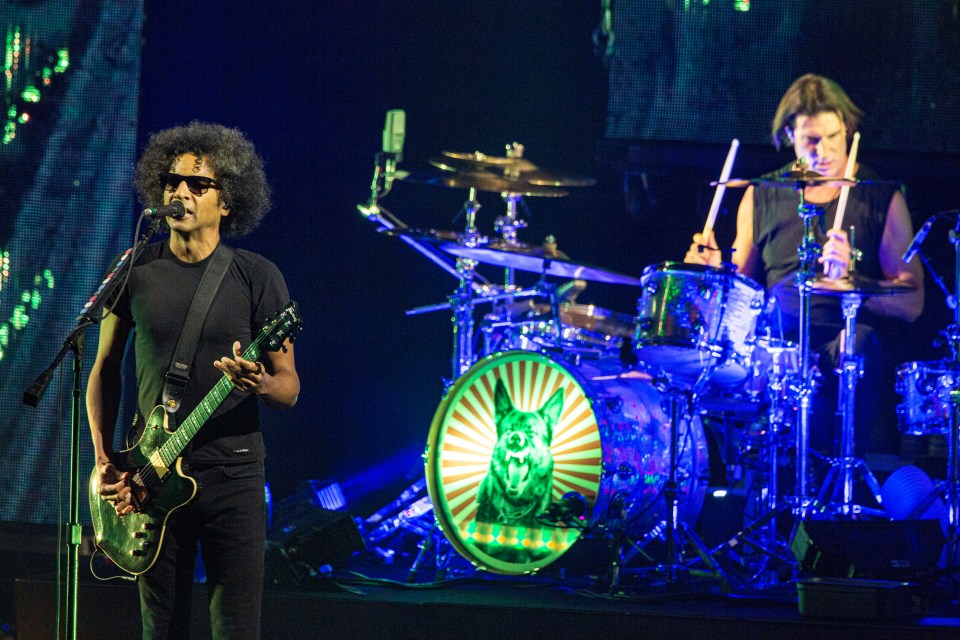 Alice in Chains performing live on stage.