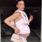 A photo of Lele Pons showing off her baby bump.