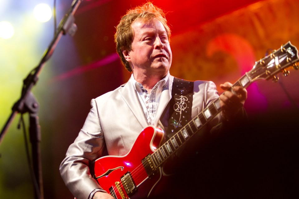 Rick Derringer of Ringo Starr's All Starr Band performing live on stage.